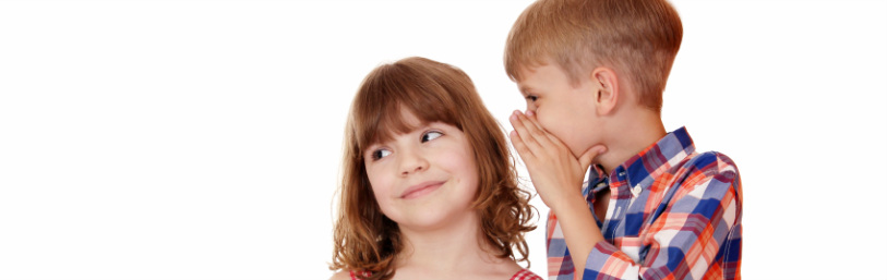 Picture of boy and girl whispering